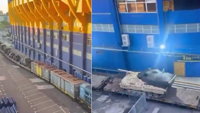 Tren cargado con vehículos militares pasa por las vías al lado del estadio Alberto J. Armando, La Bombonera.